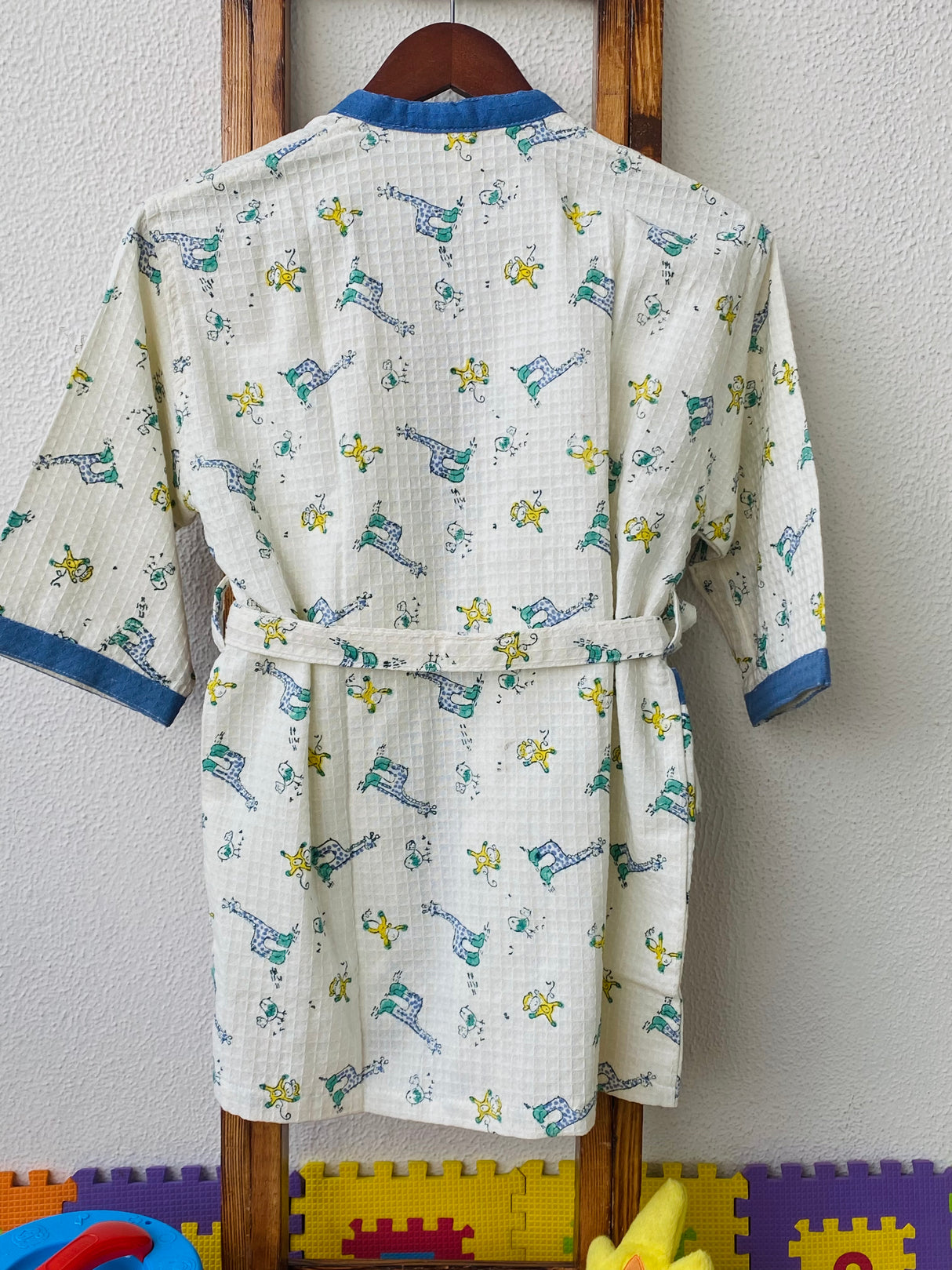 blue cotton waffle kids bathrobes handcrafted in Jaipur with giraffe and monkey print for wholesale