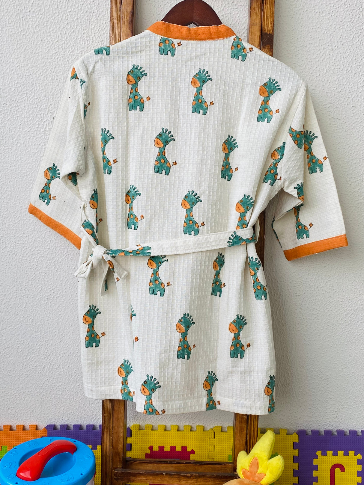 customized name kids bathrobe in waffle cotton with giraffe handblock print for gifting and resale in Denmark and Qatar