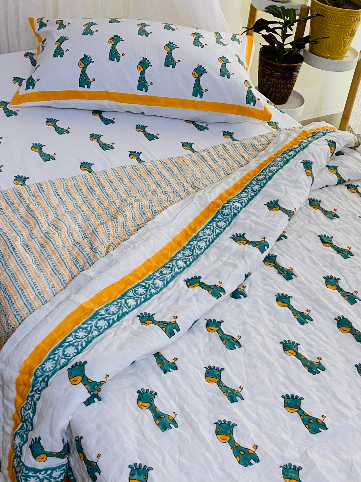 mulmul cotton kids quilt with hand block printed giraffes perfect for bulk gifting and resale in UAE and Australia