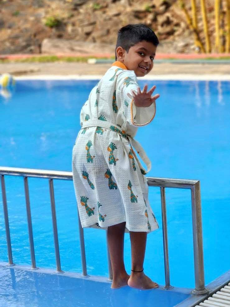 export quality waffle weave cotton kids bathrobe with custom name and giraffe block print ideal for gifting in Ireland and Sweden