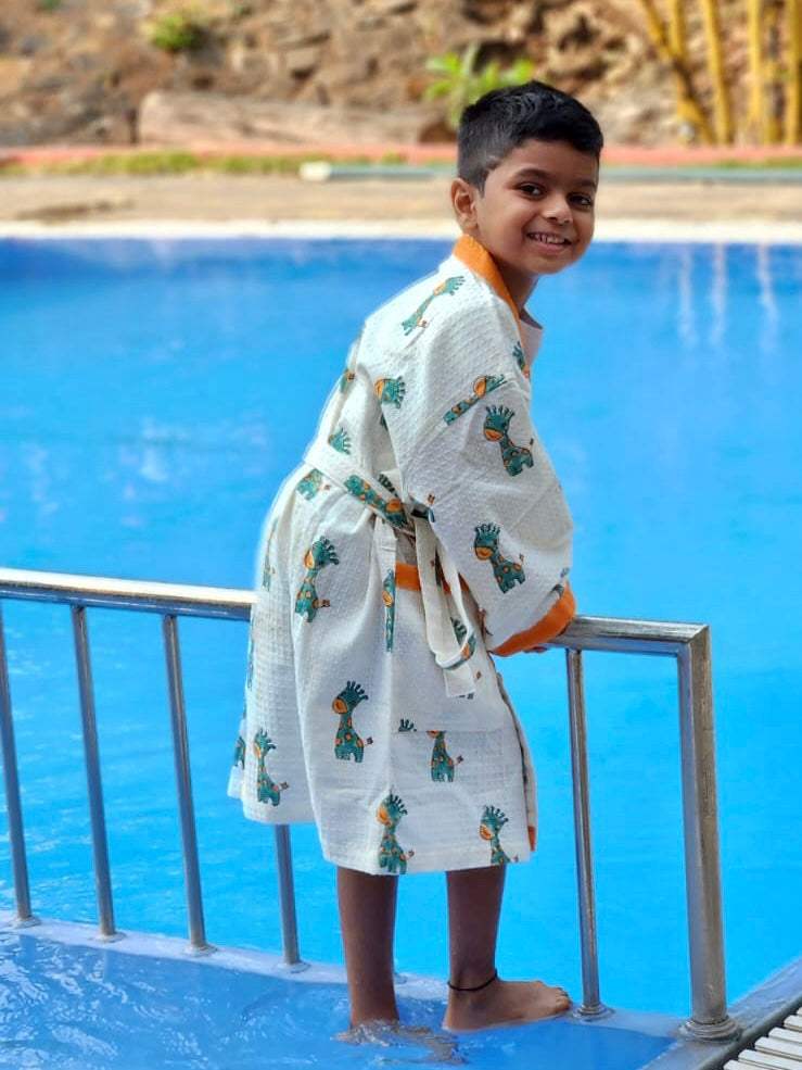 India made block printed waffle cotton kids bathrobe with embroidered name and giraffe theme exported for bulk gifting to Japan and Spain