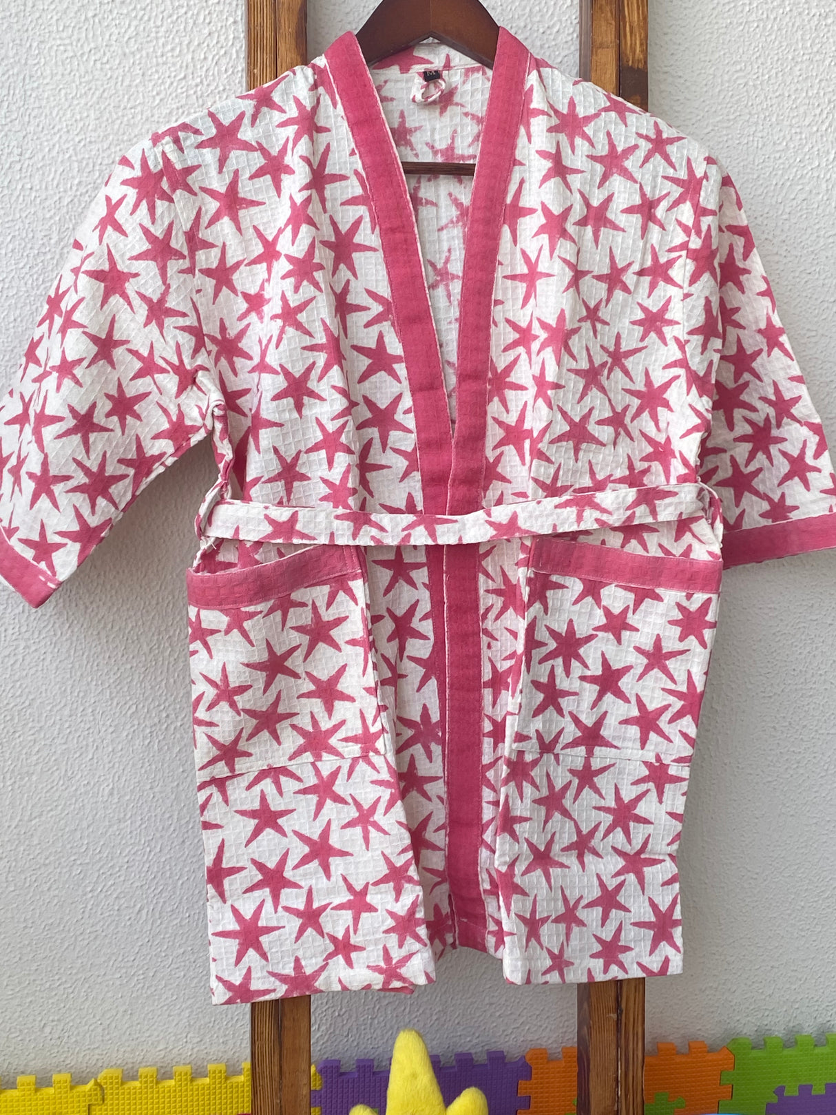 pink stars theme kids bathrobe in breathable waffle cotton customized with name embroidery ideal for playdate giveaways and bulk gifts