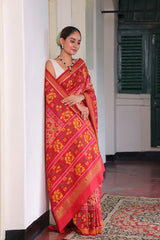 Elegant Handloom Peach and Red Mulberry Silk Ikat Patola Saree with Floral Motifs