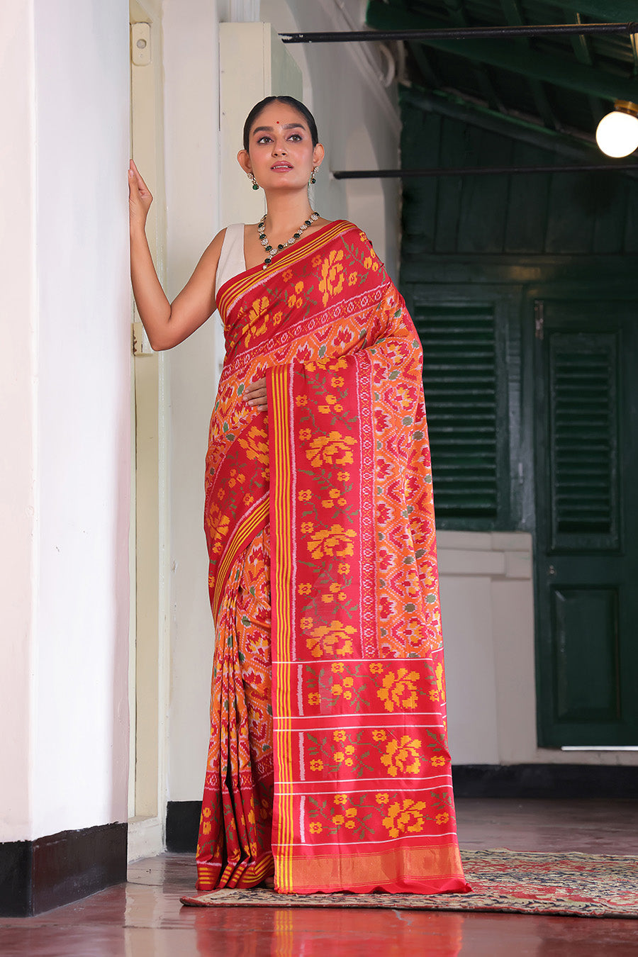 Elegant Handloom Peach and Red Mulberry Silk Ikat Patola Saree with Floral Motifs