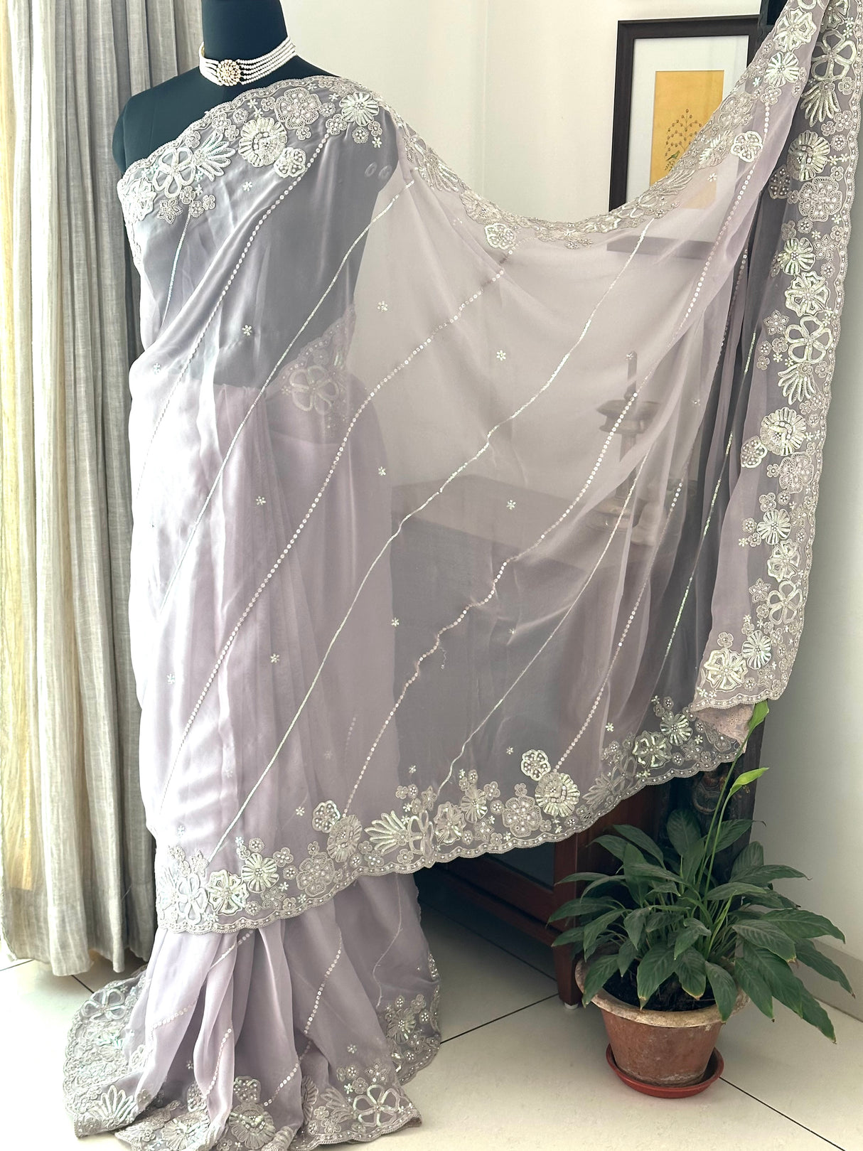 Light Lavender Georgette saree embellished with machine embroidery