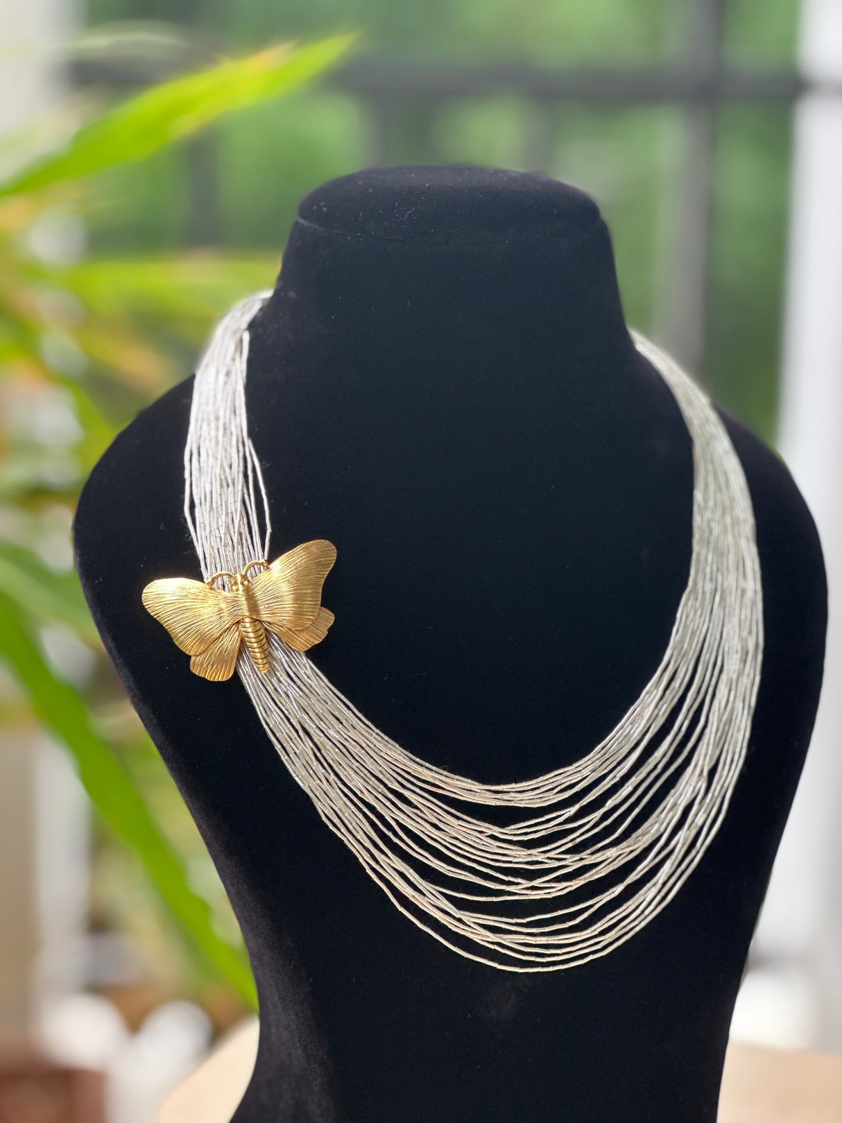 Statement necklace with chains and Butterfly in two tone