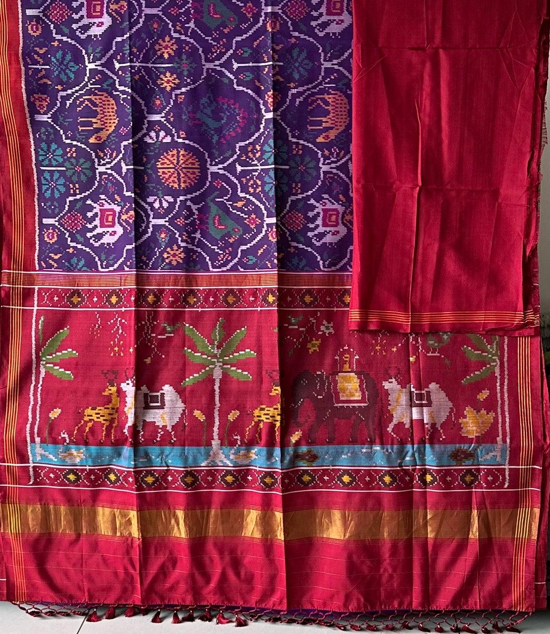 Exclusive Handloom Purple and Red Mulberry Silk Ikat Patola Saree with Animal Motifs