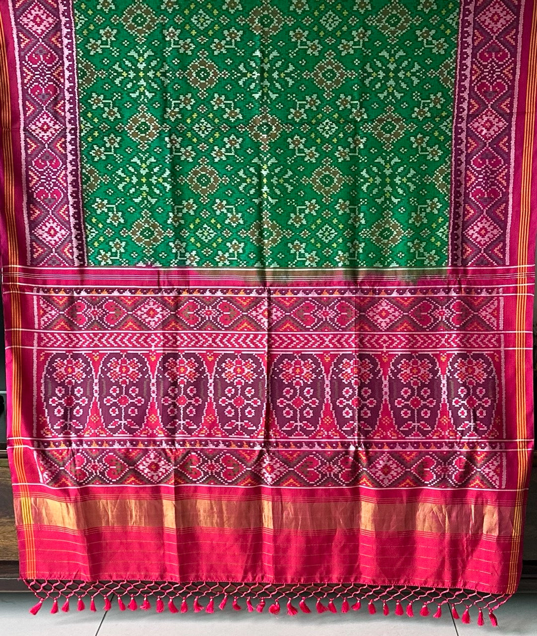 Timeless Handloom Green and Pink Mulberry Silk Ikat Patola Saree with Intricate Navratna Motif