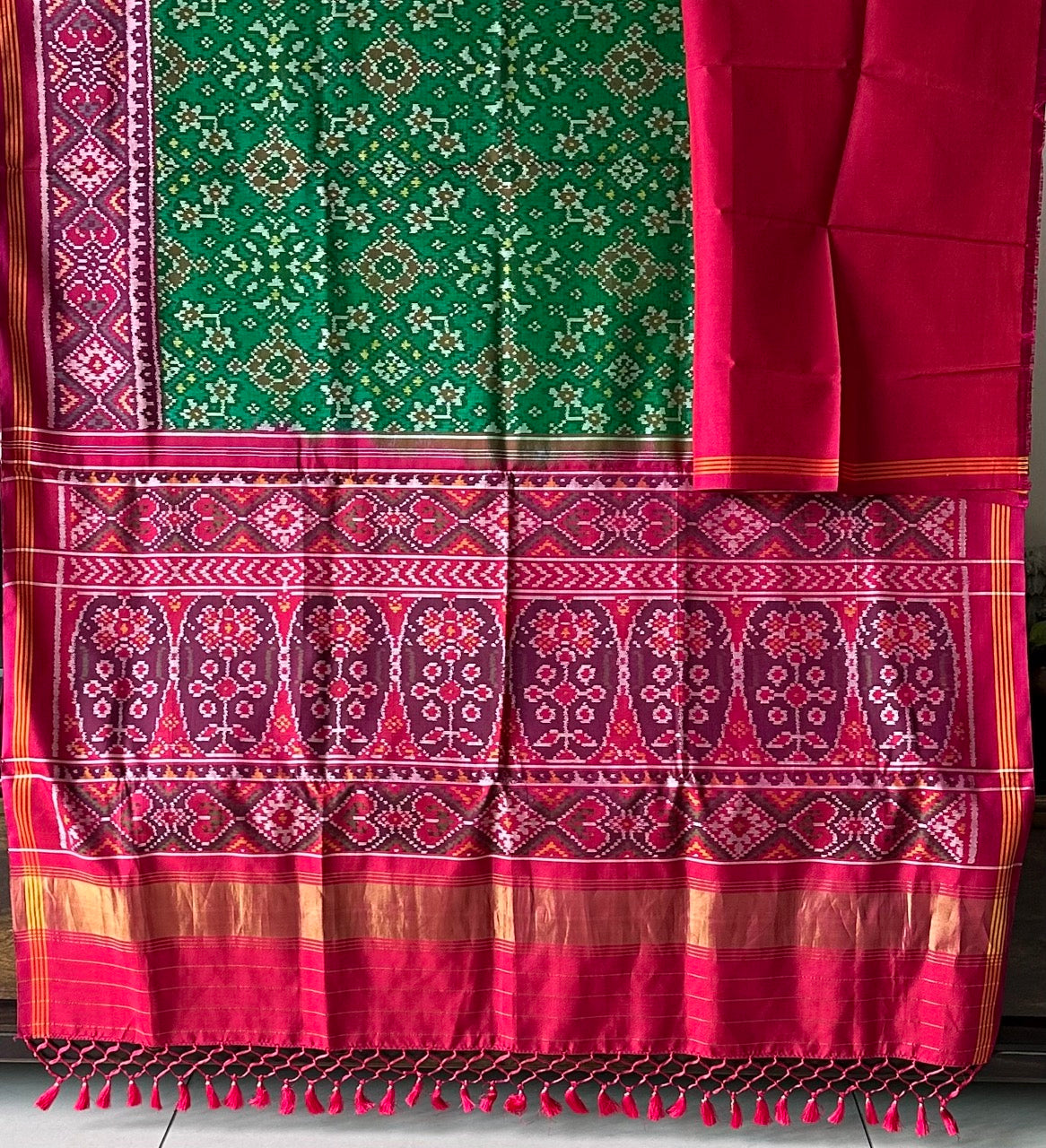 Timeless Handloom Green and Pink Mulberry Silk Ikat Patola Saree with Intricate Navratna Motif