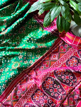 Timeless Handloom Green and Pink Mulberry Silk Ikat Patola Saree with Intricate Navratna Motif