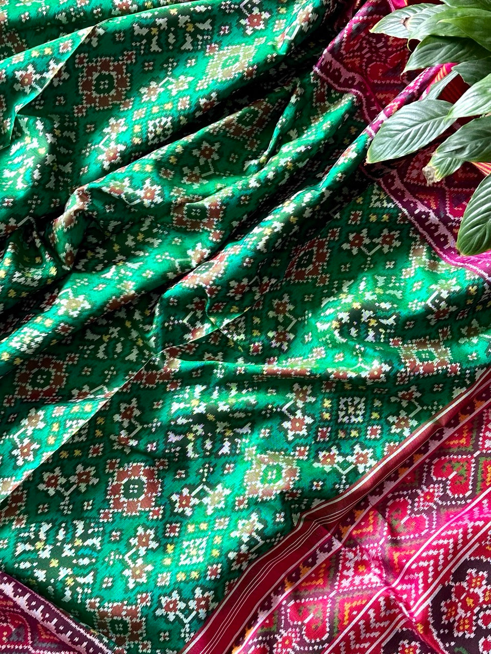 Timeless Handloom Green and Pink Mulberry Silk Ikat Patola Saree with Intricate Navratna Motif