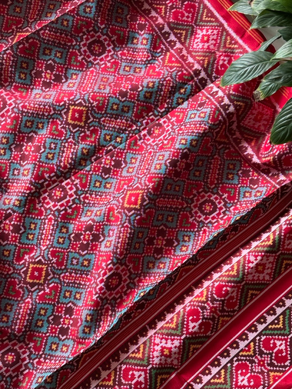 Elegant Handloom Teal and Red Mulberry Silk Ikat Patola Saree with Pan Bhat Motifs