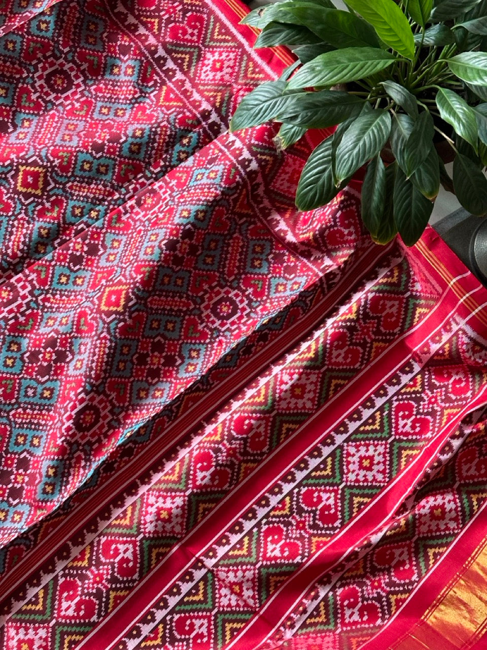 Elegant Handloom Teal and Red Mulberry Silk Ikat Patola Saree with Pan Bhat Motifs