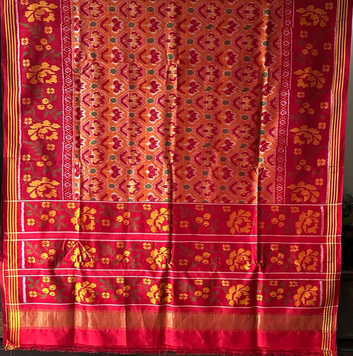 Elegant Handloom Peach and Red Mulberry Silk Ikat Patola Saree with Floral Motifs