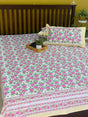 Pink floral hand block printed bedsheet on white base
