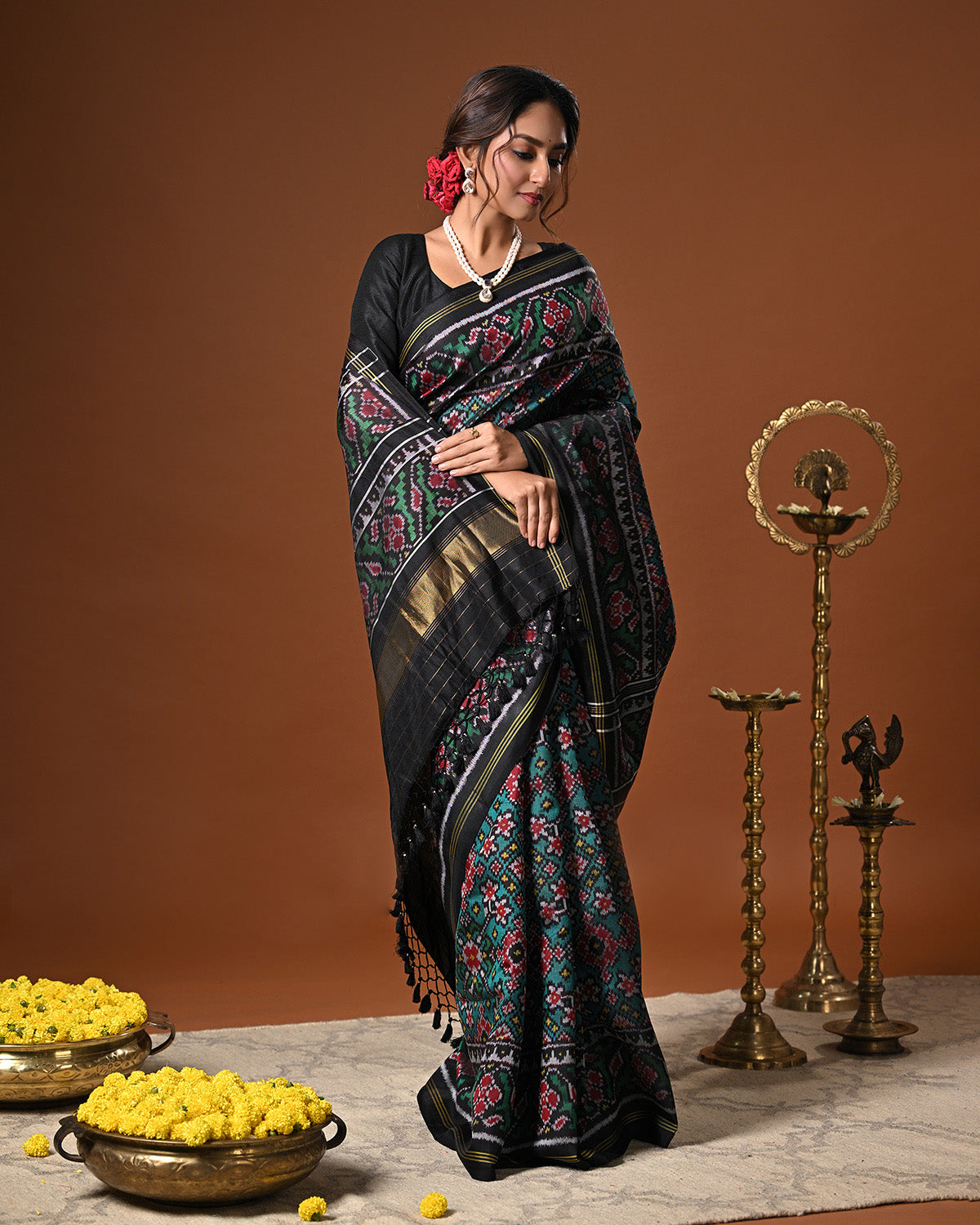 Stylish Handloom Teal and Black Mulberry Silk Ikat Patola Saree with Intricate Navratna Motif