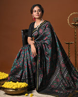 Stylish Handloom Teal and Black Mulberry Silk Ikat Patola Saree with Intricate Navratna Motif