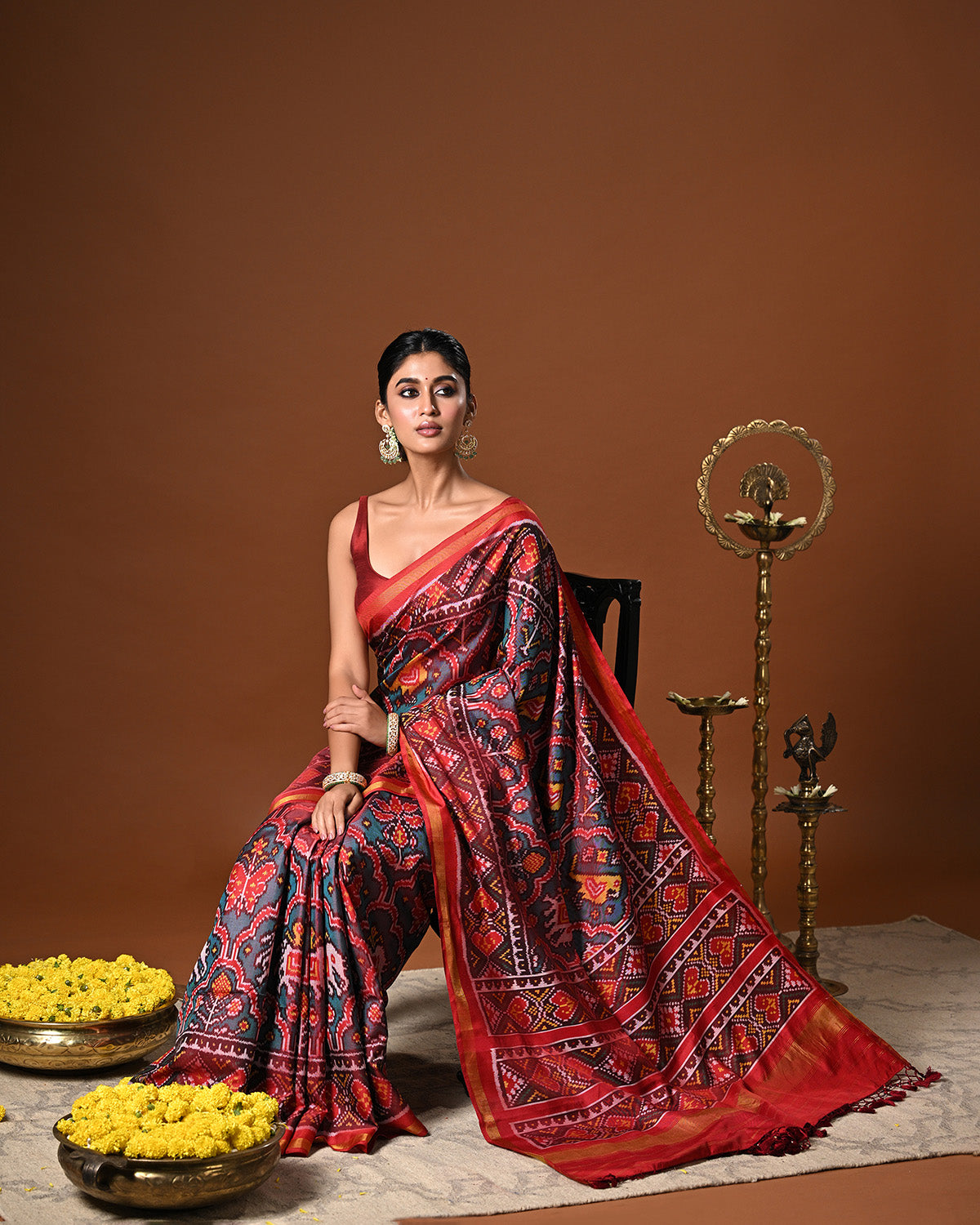 Distinct Handloom Teal and Red Mulberry Silk Ikat Patola Saree with Flora and Fauna