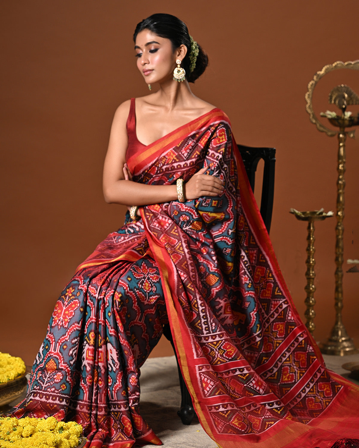 Distinct Handloom Teal and Red Mulberry Silk Ikat Patola Saree with Flora and Fauna