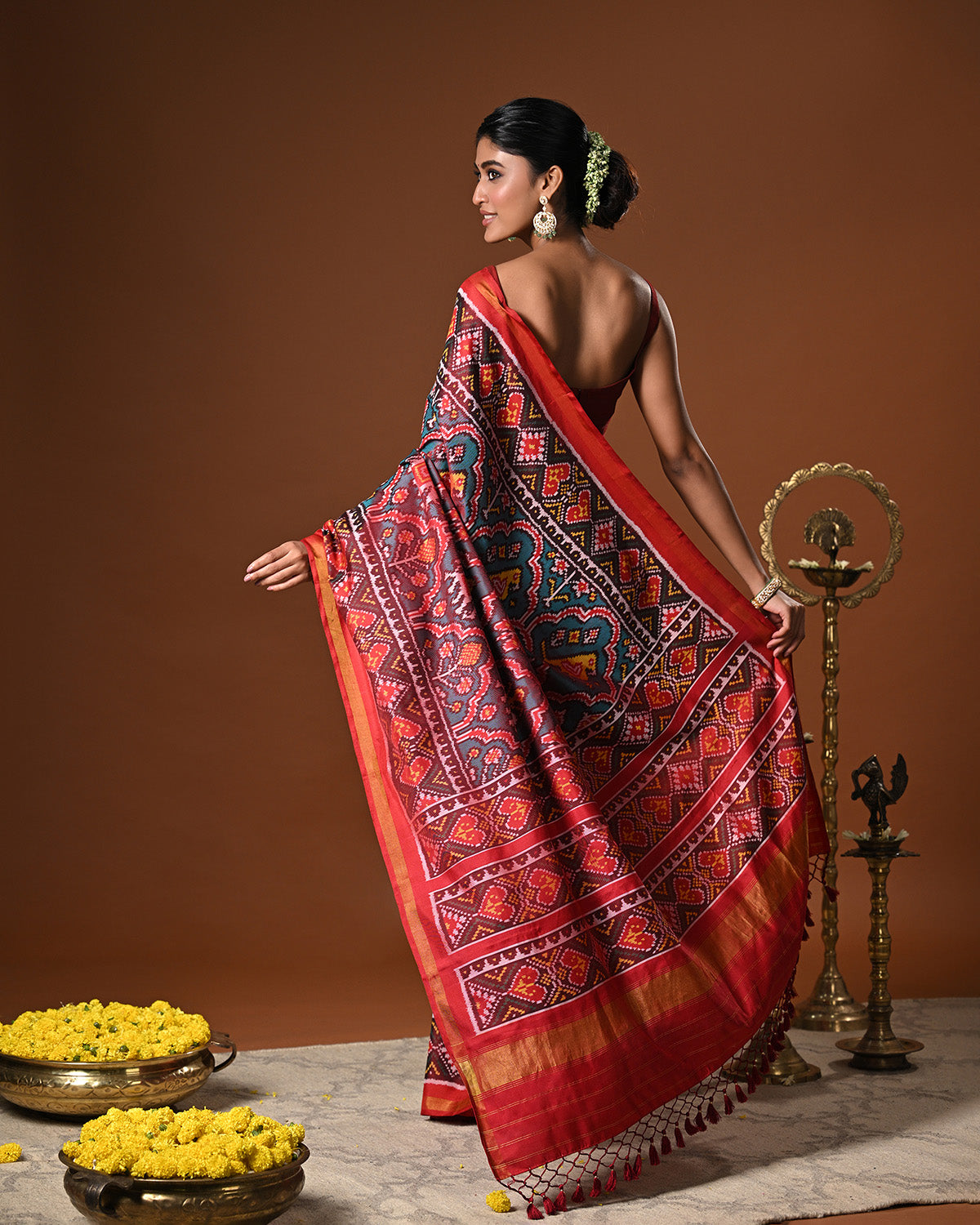 Distinct Handloom Teal and Red Mulberry Silk Ikat Patola Saree with Flora and Fauna