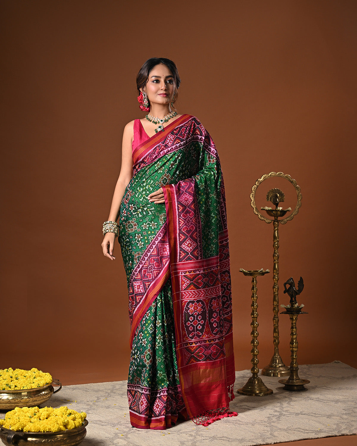 Timeless Handloom Green and Pink Mulberry Silk Ikat Patola Saree with Intricate Navratna Motif