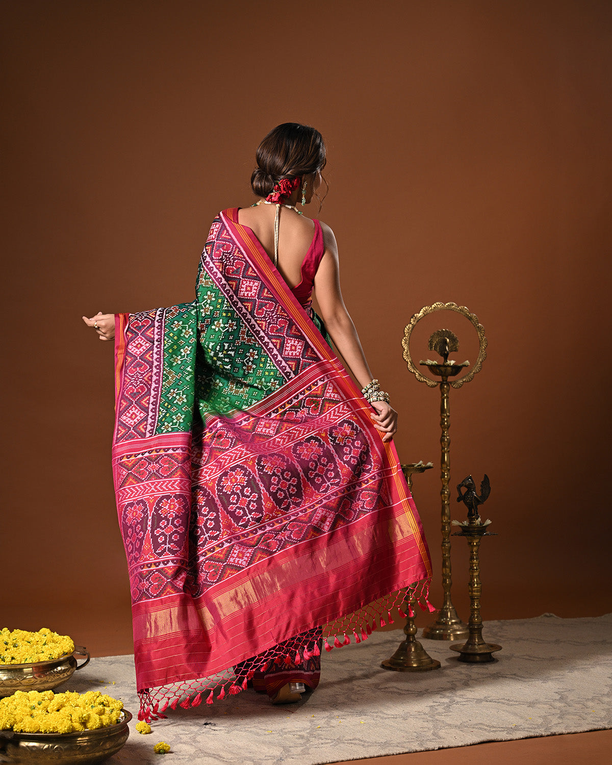 Timeless Handloom Green and Pink Mulberry Silk Ikat Patola Saree with Intricate Navratna Motif