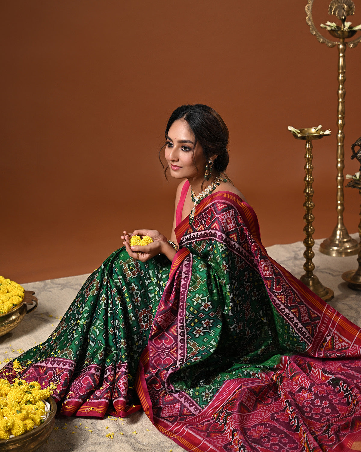 Timeless Handloom Green and Pink Mulberry Silk Ikat Patola Saree with Intricate Navratna Motif