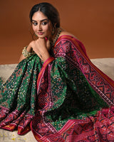 Timeless Handloom Green and Pink Mulberry Silk Ikat Patola Saree with Intricate Navratna Motif