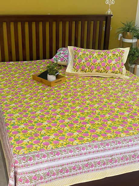 Yellow cotton bedsheet with pink floral print