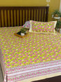 Yellow cotton bedsheet with pink floral print