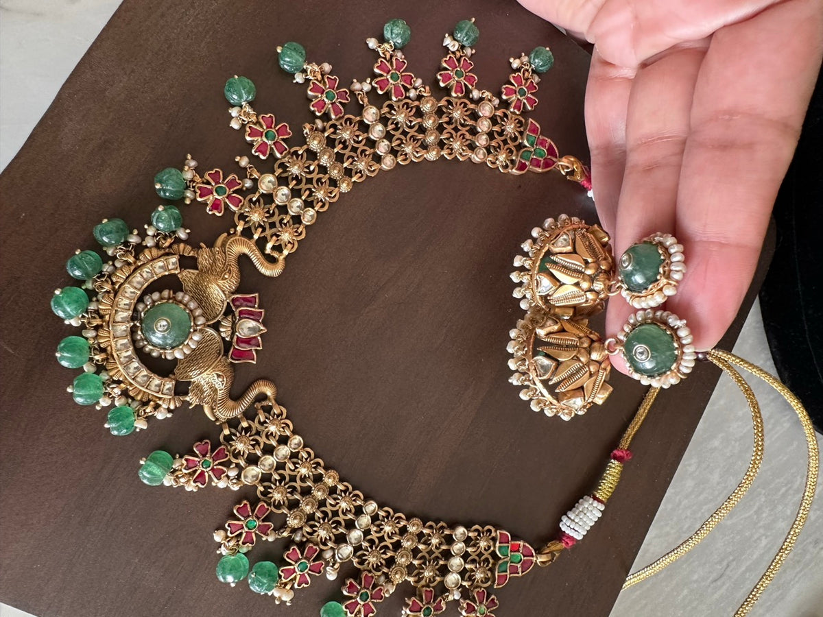 Katha of Jewels antique finish 92.5 sterling silver temple necklace set with peacock motif, green aventurine beads, and matching jhumka earrings