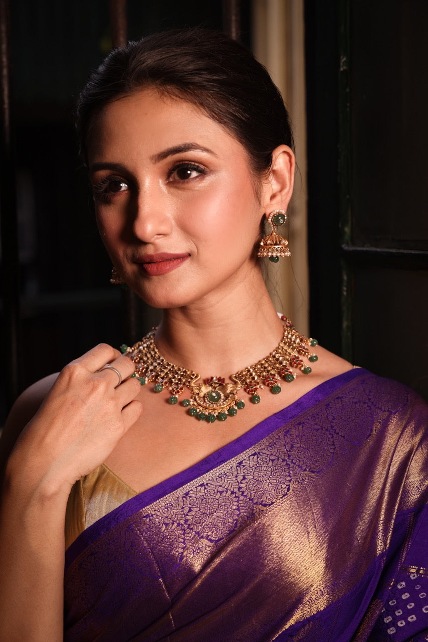 Katha of Jewels antique finish 92.5 sterling silver temple necklace set with peacock motif, green aventurine beads, and matching jhumka earrings