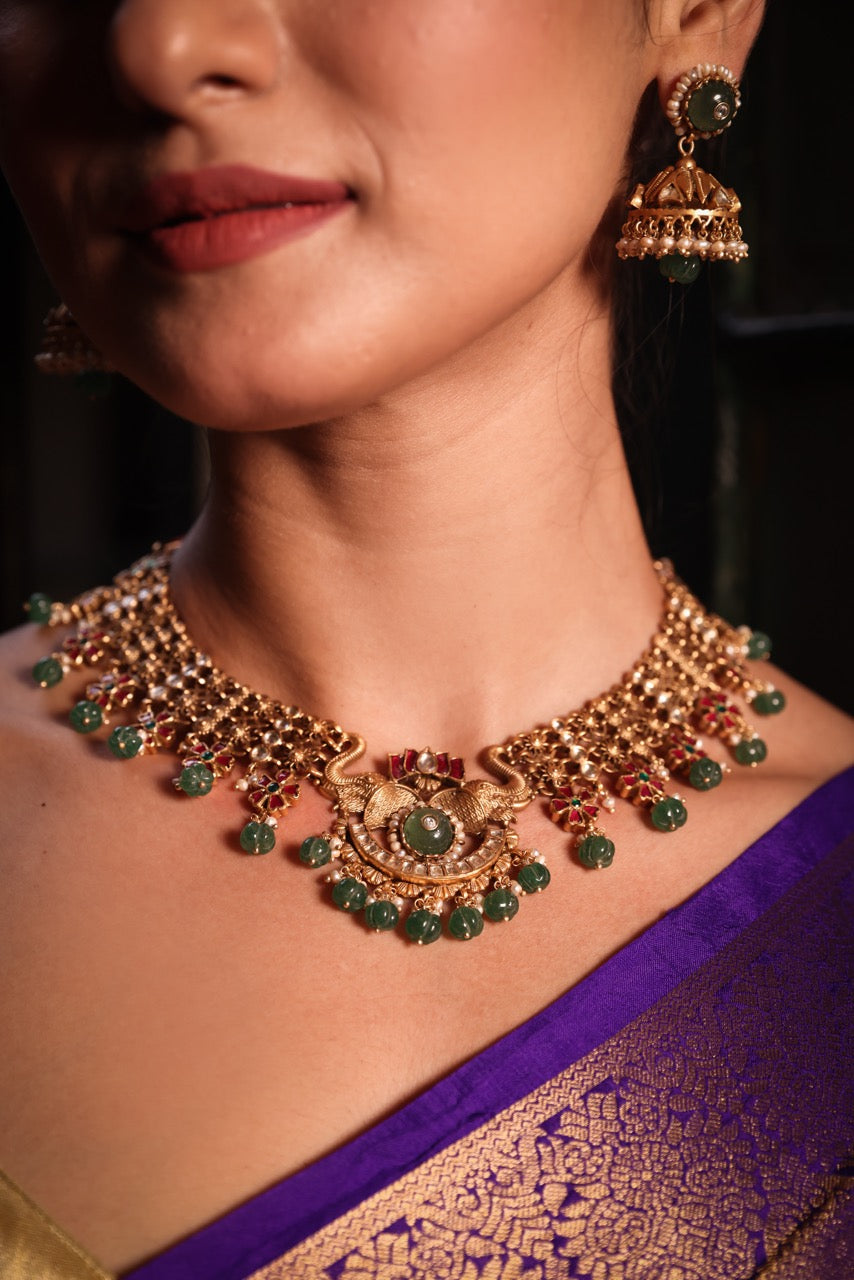 Katha of Jewels antique finish 92.5 sterling silver temple necklace set with peacock motif, green aventurine beads, and matching jhumka earrings