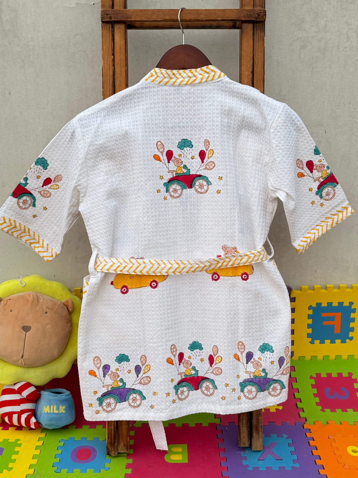 Back view of the cars theme kids bathrobe, highlighting the design and fit