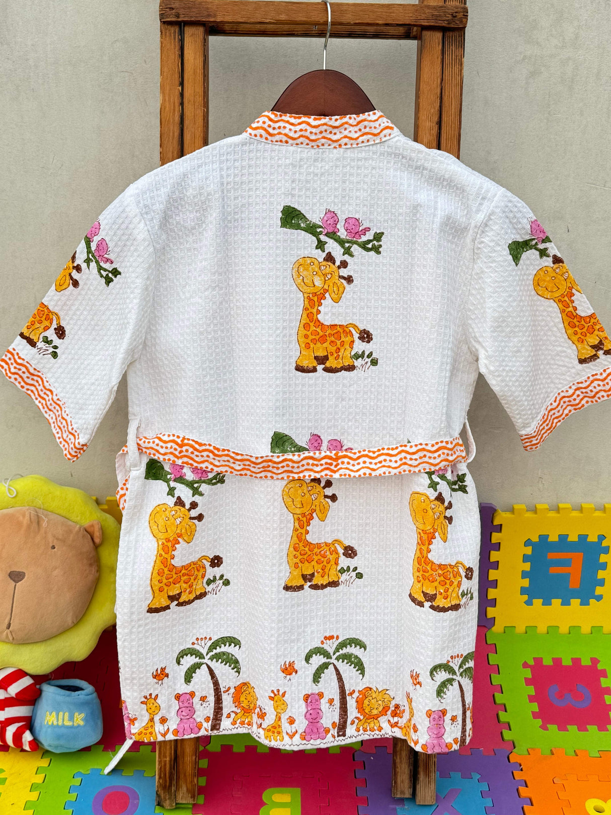 Back view of the Giggly Giraffe kids bathrobe.