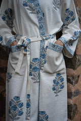 blue-floral-cotton-waffle-bathrobe-laying-flat-view