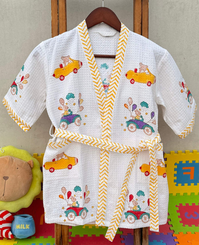 Cars theme kids bathrobe made from cotton waffle fabric, featuring a vibrant block print design.