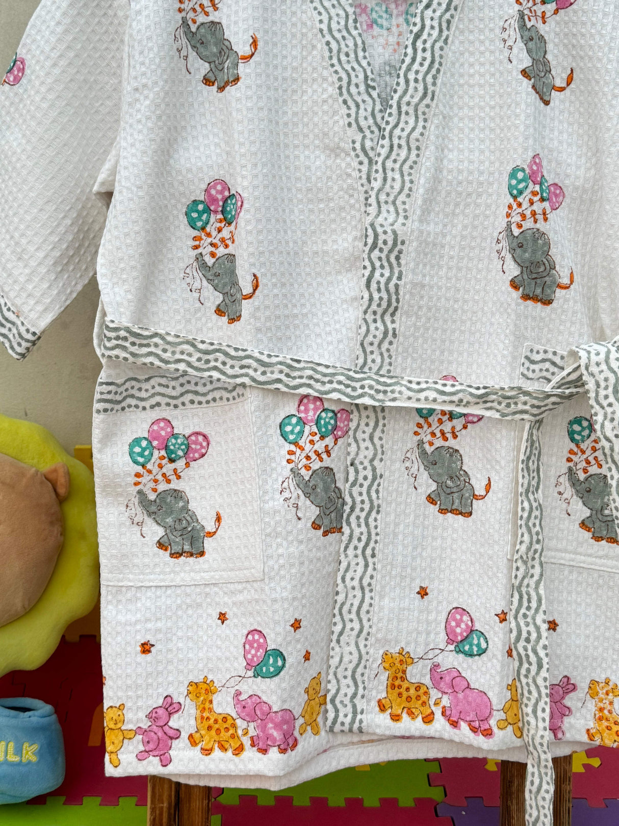 Detail shot of the hood of the elephant kids bathrobe, featuring playful elephant ears.
