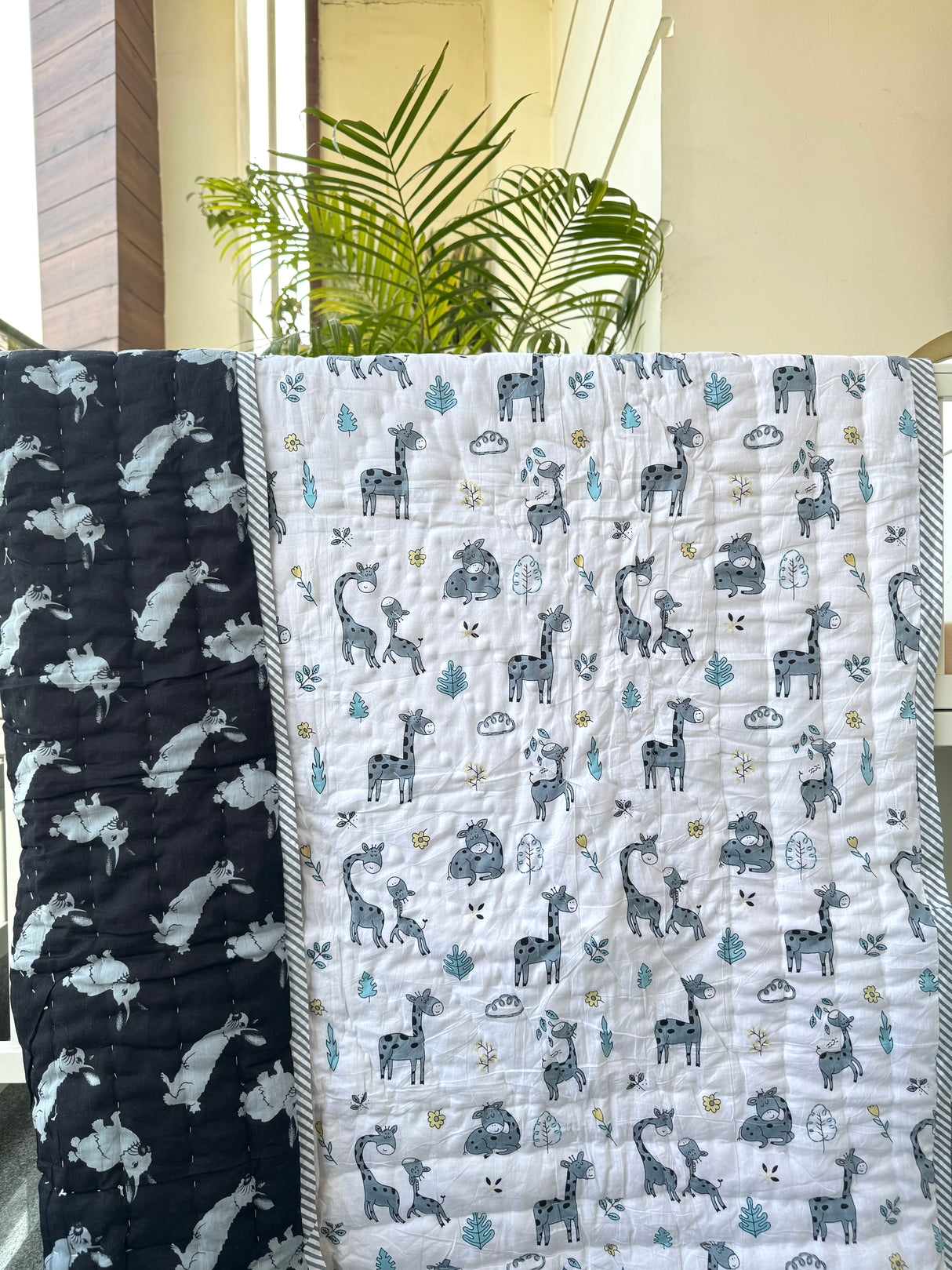 grey white and black jungle animal quilt for babies with giraffe and rabbit prints ideal for birthday gifting in Germany and Malaysia