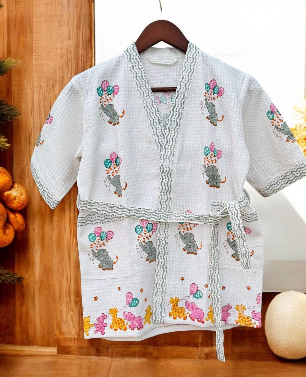 Elephant kids bathrobe made from cotton waffle fabric, featuring a colorful block print