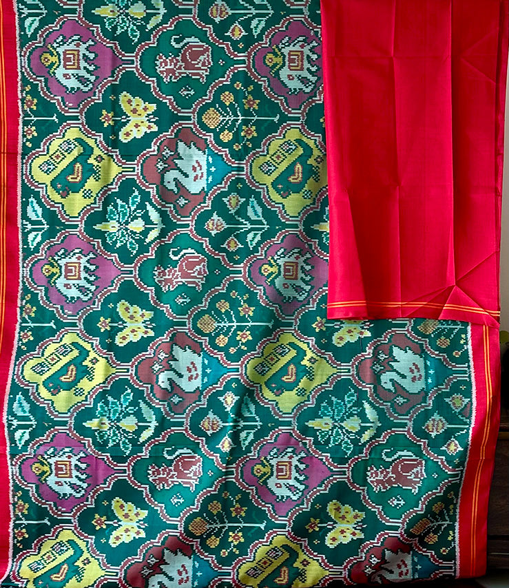 Exclusive Handloom Green and Red Mulberry Silk Ikat Patola Saree with Floral and Animal Motifs