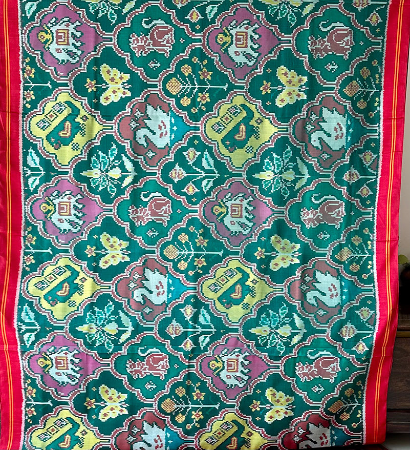 Exclusive Handloom Green and Red Mulberry Silk Ikat Patola Saree with Floral and Animal Motifs