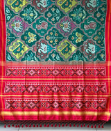 Exclusive Handloom Green and Red Mulberry Silk Ikat Patola Saree with Floral and Animal Motifs