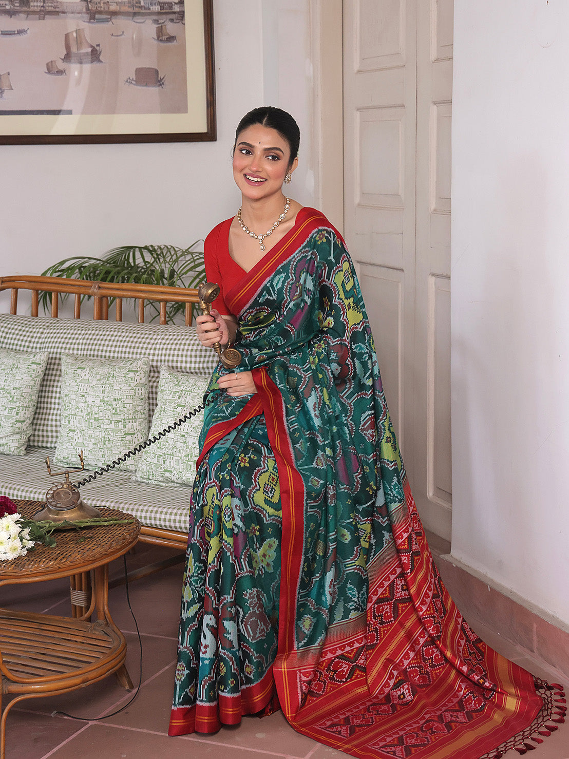 Exclusive Handloom Green and Red Mulberry Silk Ikat Patola Saree with Floral and Animal Motifs