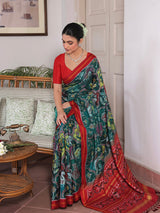 Exclusive Handloom Green and Red Mulberry Silk Ikat Patola Saree with Floral and Animal Motifs