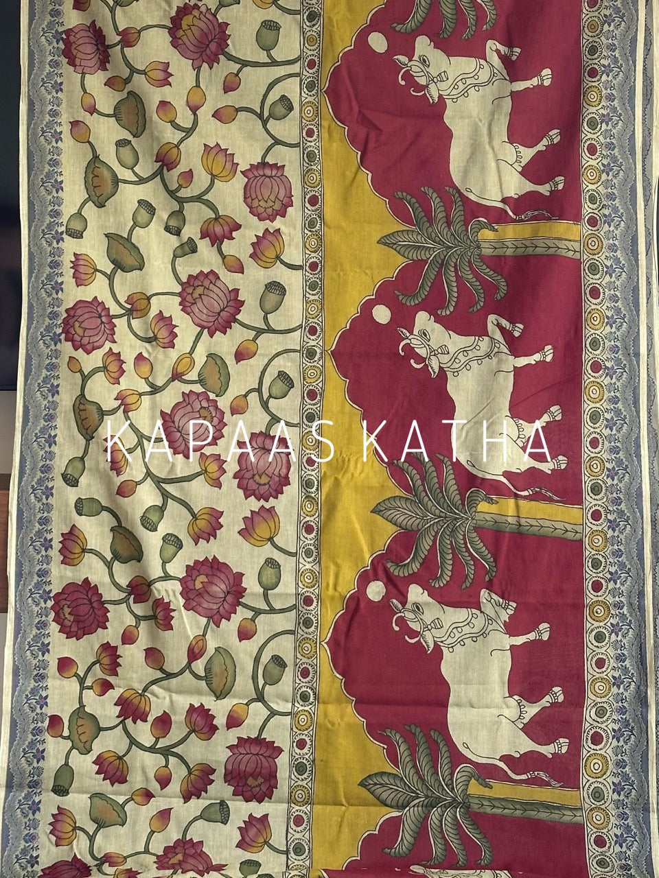 Shop handpainted Chettinad cotton Kalamkari saree featuring traditional Nandi and botanical artwork. Breathable, handloom luxury online at Kapaas Katha.