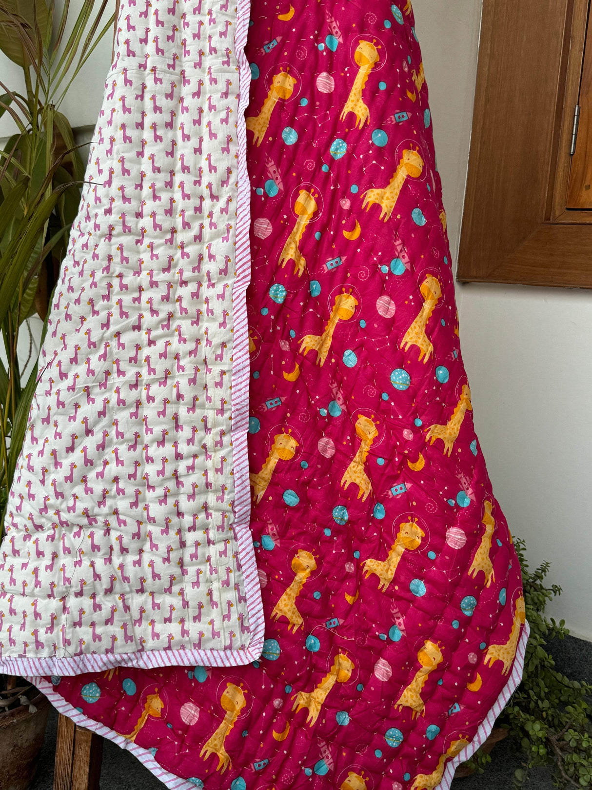 soft-breathable-mulmul-cotton-kids-quilt-with-pink-giraffe-and-moon-star-print-perfect-for-toddlers-in-uae-and-australia