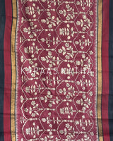 Shop handpainted Chettinad cotton silk Kalamkari saree in maroon with contrast black temple zari border. Lightweight handloom elegance online at Kapaas Katha.