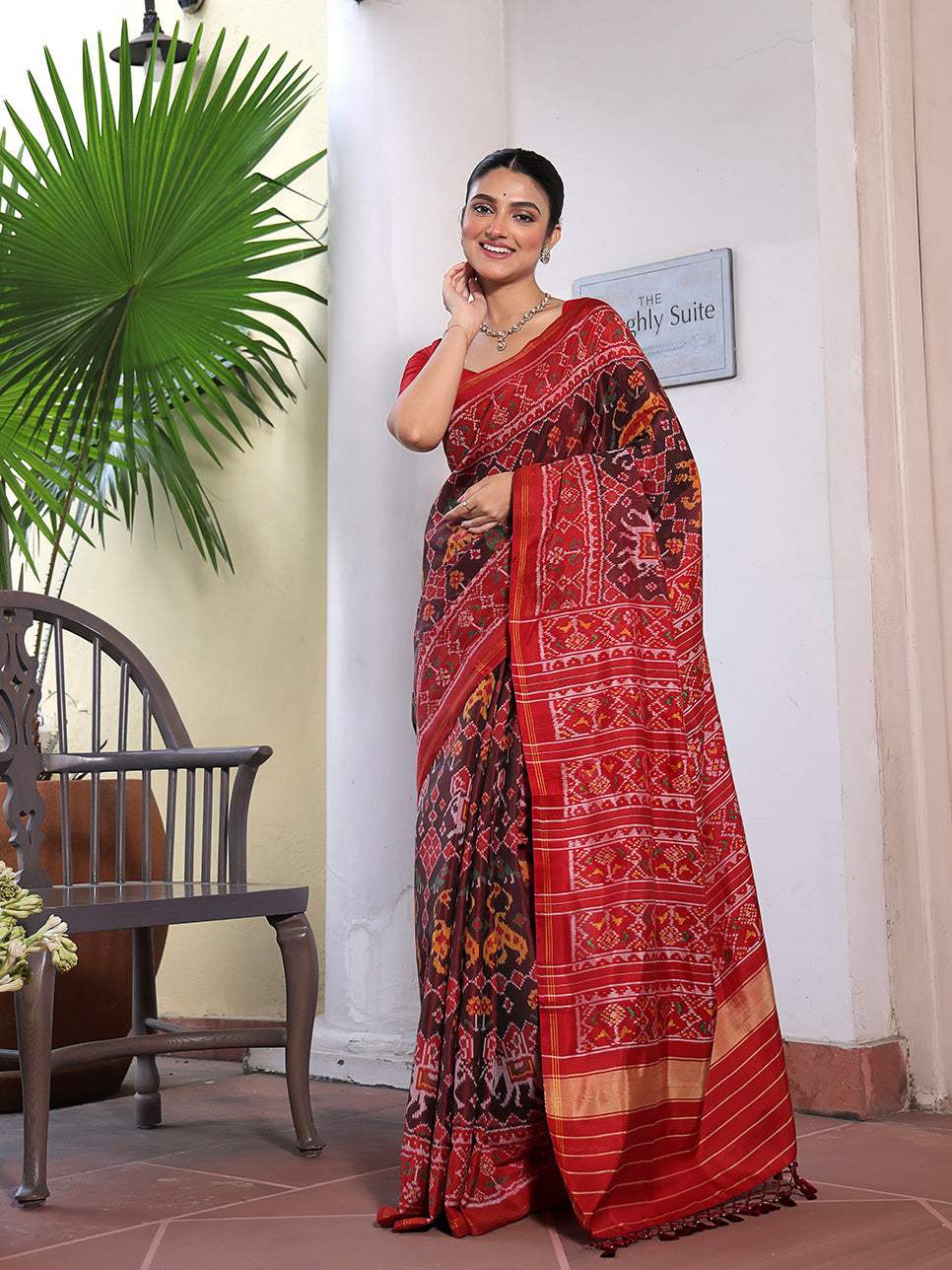 Graceful Handloom Brown and Red Mulberry Silk Ikat Patola Saree with Tiger and Elephant Motifs