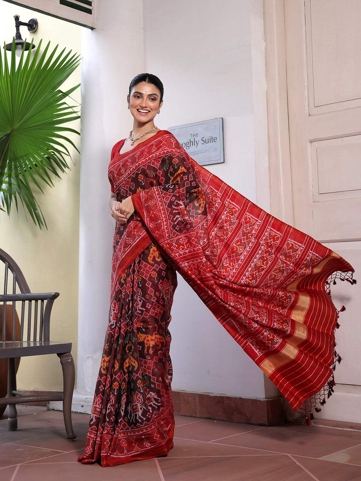 Graceful Handloom Brown and Red Mulberry Silk Ikat Patola Saree with Tiger and Elephant Motifs